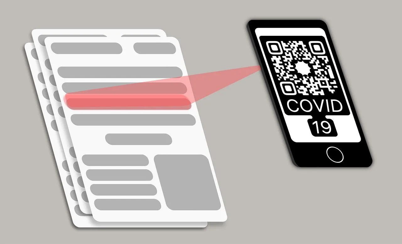 A pub table from above with a numbered disc, a paper menu, a QR code card and two drinks