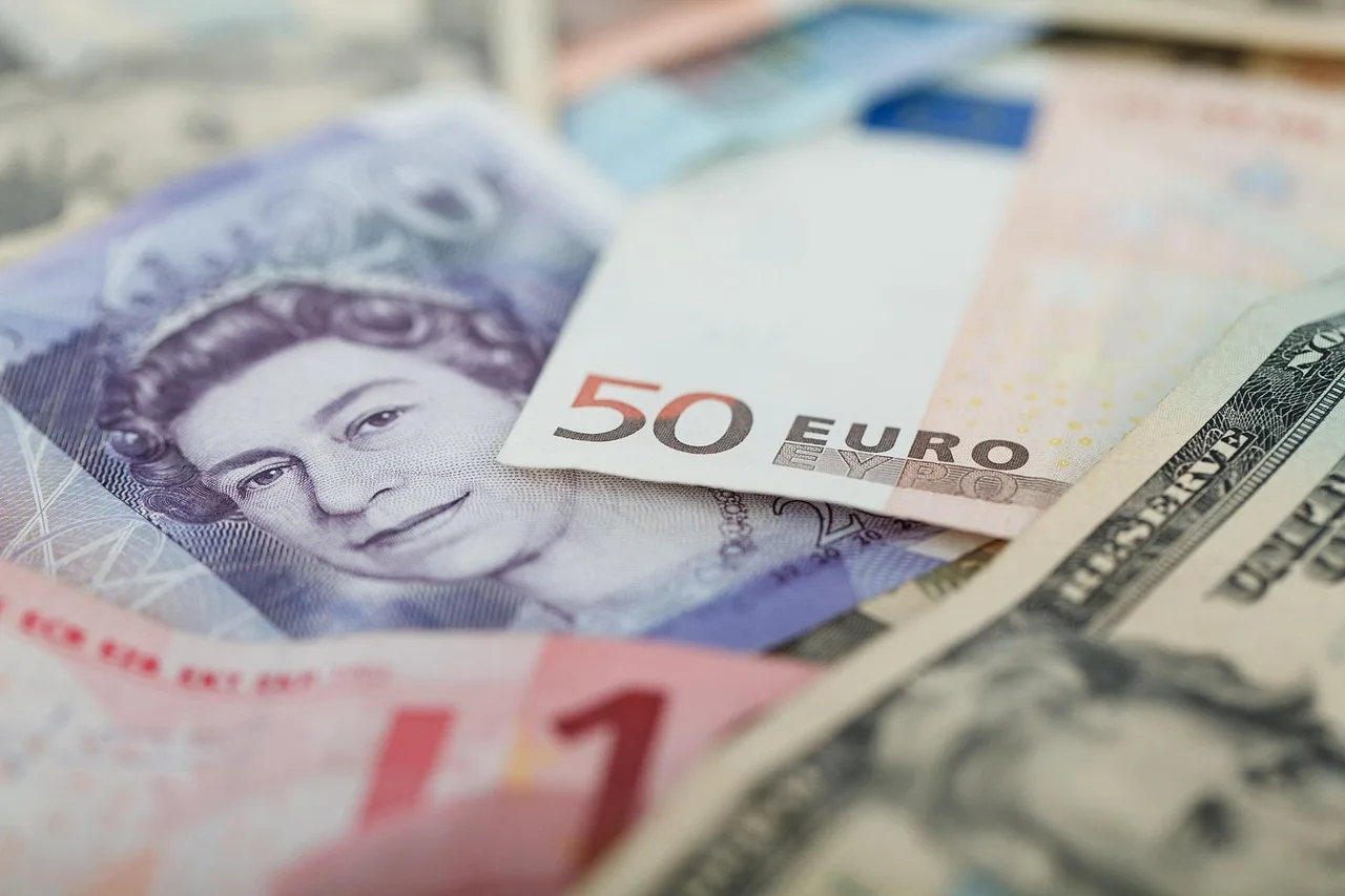 Banknotes passing through the window slot of a bureau de change beneath a rate board