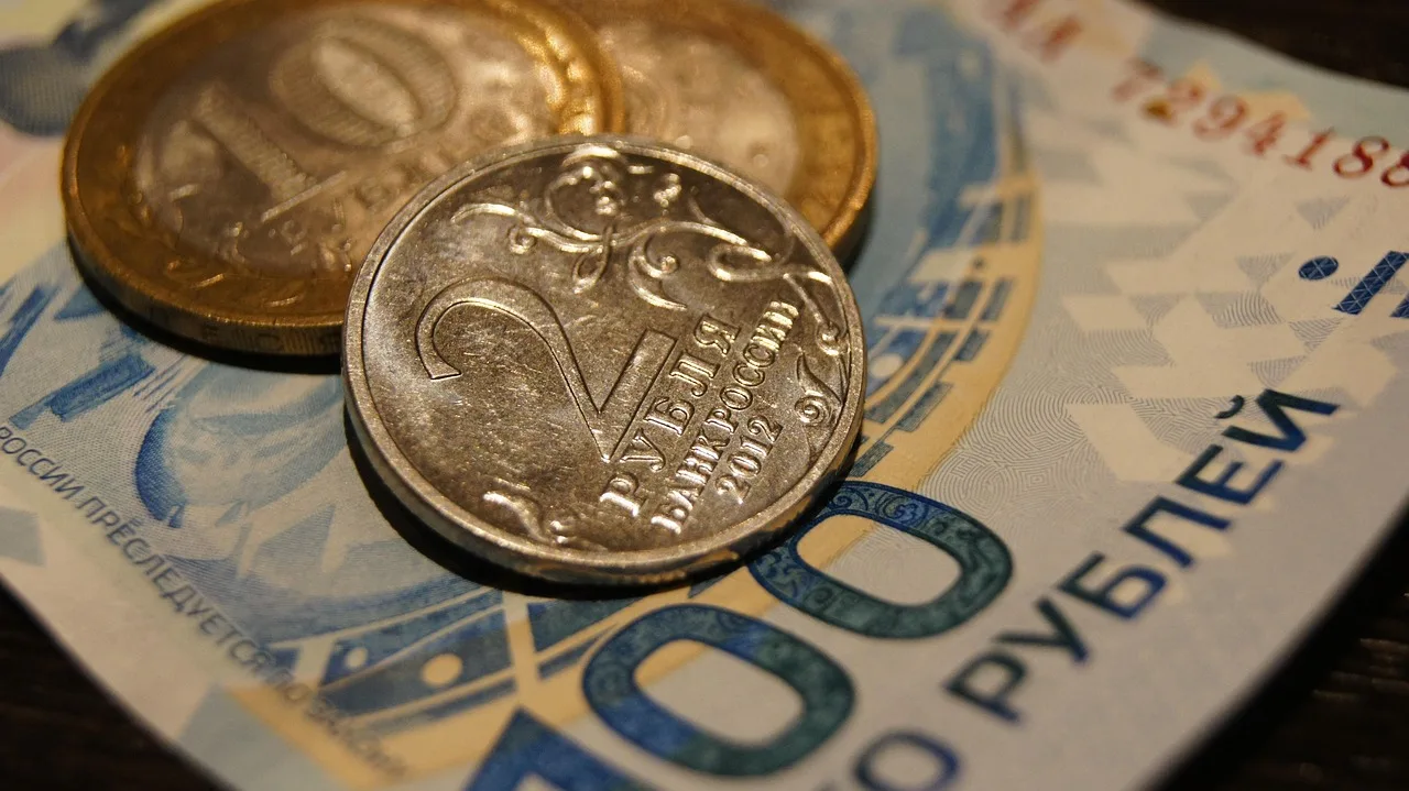 Overhead view of a restaurant bill, mixed European coins and a card terminal on a cafe table