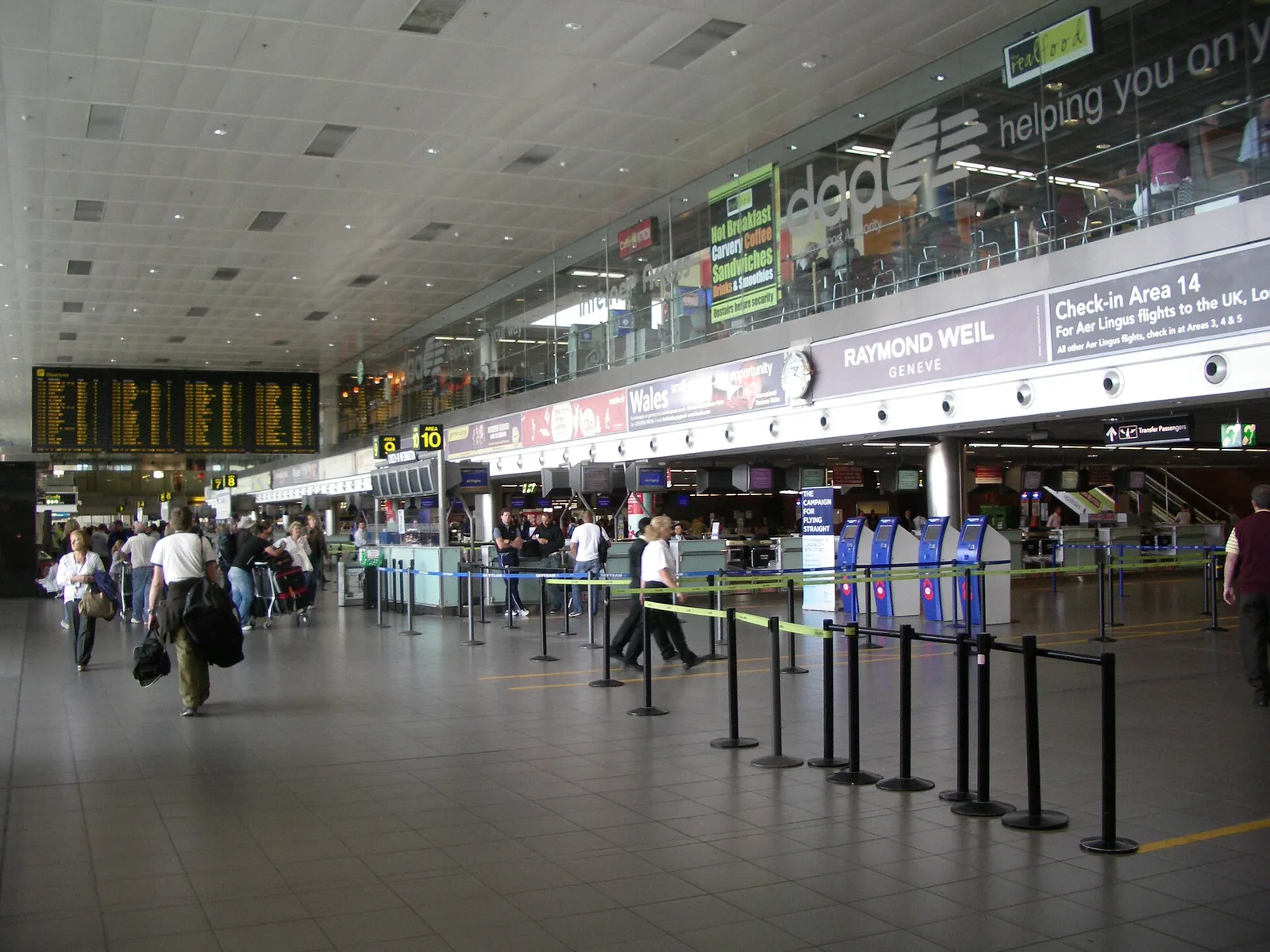 Passengers and check-in desks on the departures level of Terminal 1 at Dublin Airport