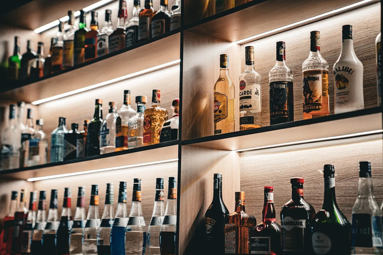 A printed price list on the wall of an Italian bar showing separate columns of prices