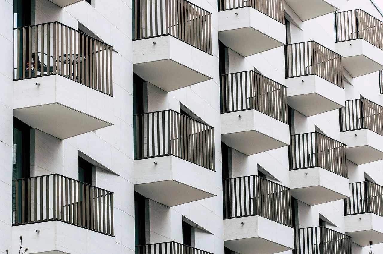 The same apartment interior photograph appearing on four different websites under different names