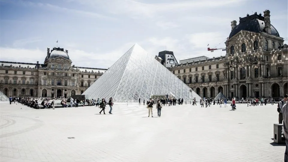 The glass pyramid and courtyard of the Louvre in Paris.