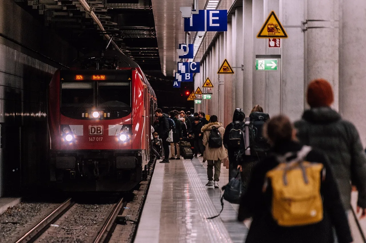 A French station notice with French text above a smaller English translation